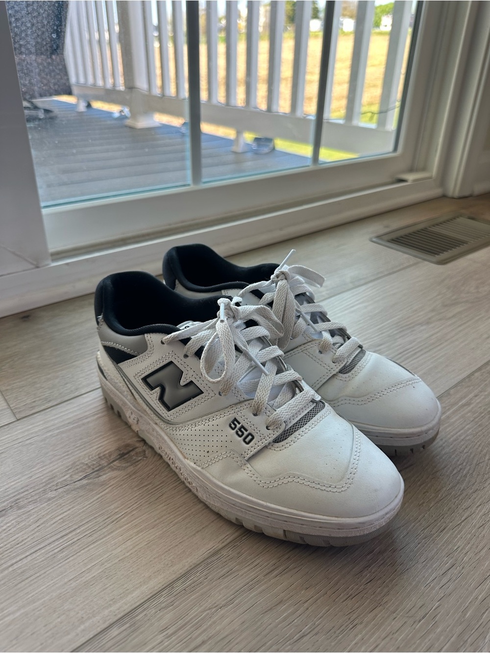 New Balance Men’s White and Black 550 Leather Sneakers